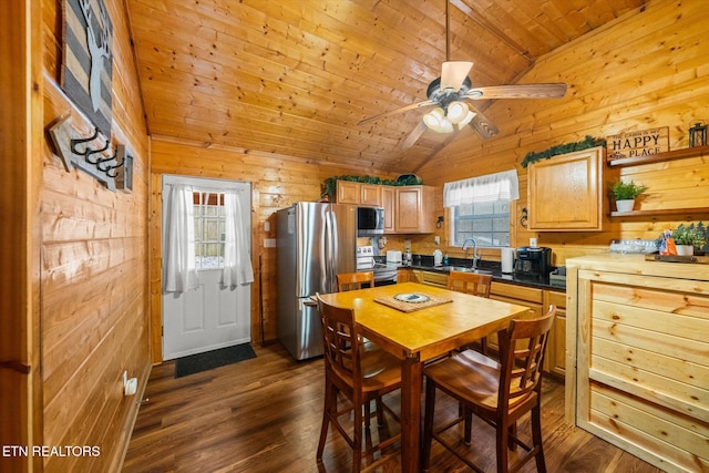 dining area with dark hardwood / wood-style flooring, wood ceiling, ceiling fan, lofted ceiling, and wood walls