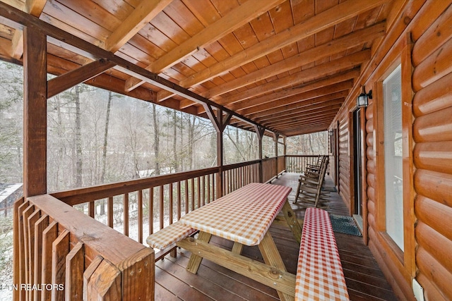 view of snow covered deck