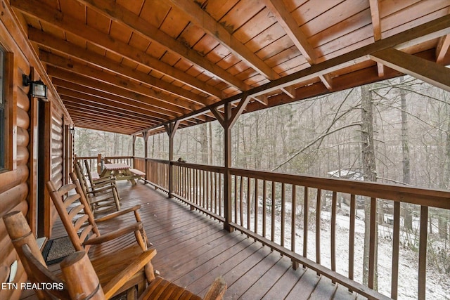 view of snow covered deck