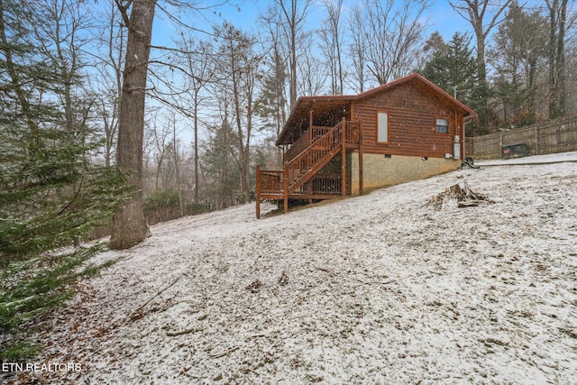 view of property exterior featuring a wooden deck