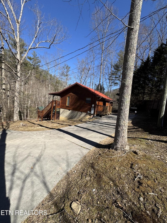 exterior space with concrete driveway