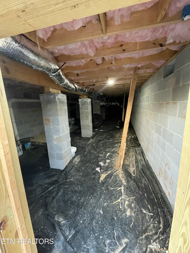 interior details featuring concrete block wall