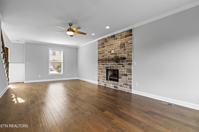 unfurnished living room featuring a fireplace, ceiling fan, dark hardwood / wood-style flooring, and crown molding