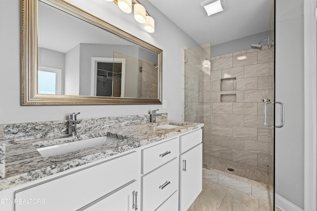 bathroom with vanity and walk in shower