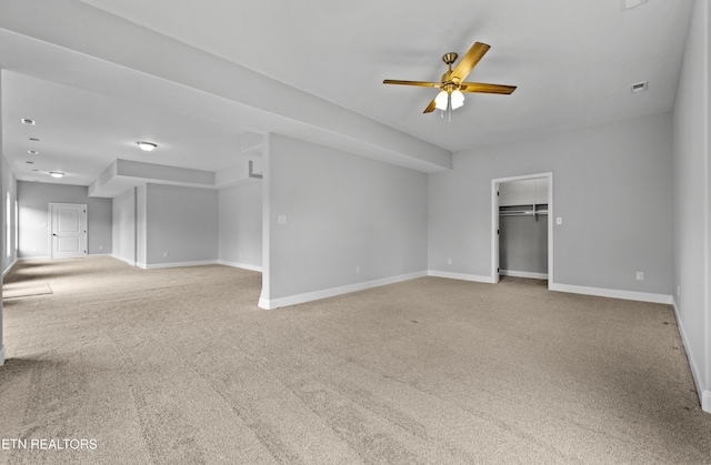 carpeted empty room with ceiling fan