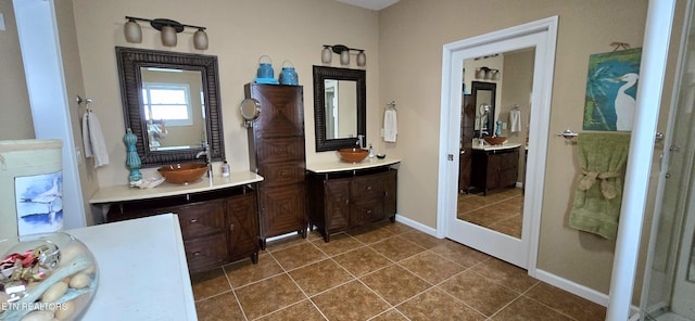 bathroom with tile patterned floors and vanity