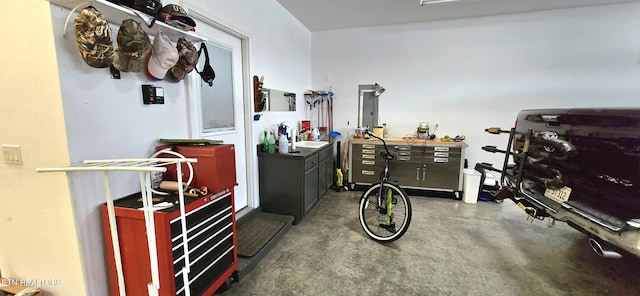 misc room featuring concrete floors and a workshop area