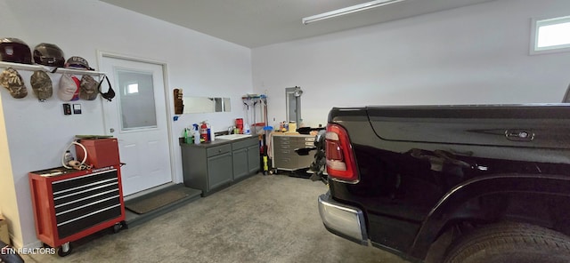 interior space featuring light colored carpet and sink