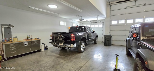 garage featuring a workshop area and a garage door opener