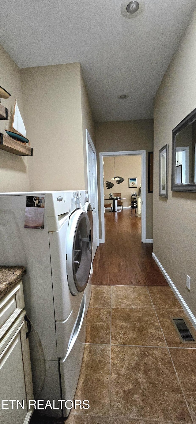 laundry area with washer and clothes dryer