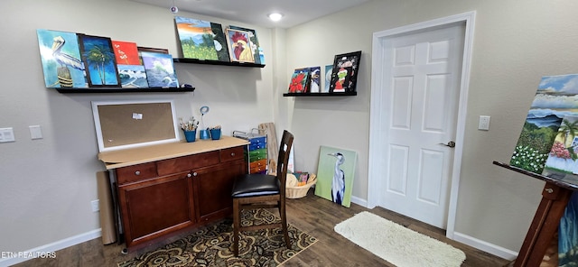 office with dark hardwood / wood-style flooring