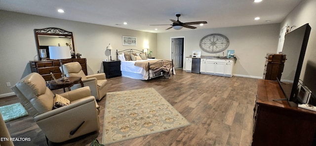 bedroom featuring ceiling fan and hardwood / wood-style floors