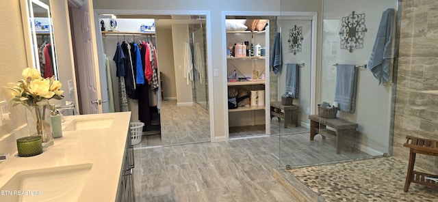 bathroom with vanity and walk in shower