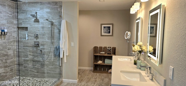 bathroom featuring vanity and a tile shower