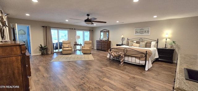 bedroom featuring ceiling fan and wood-type flooring