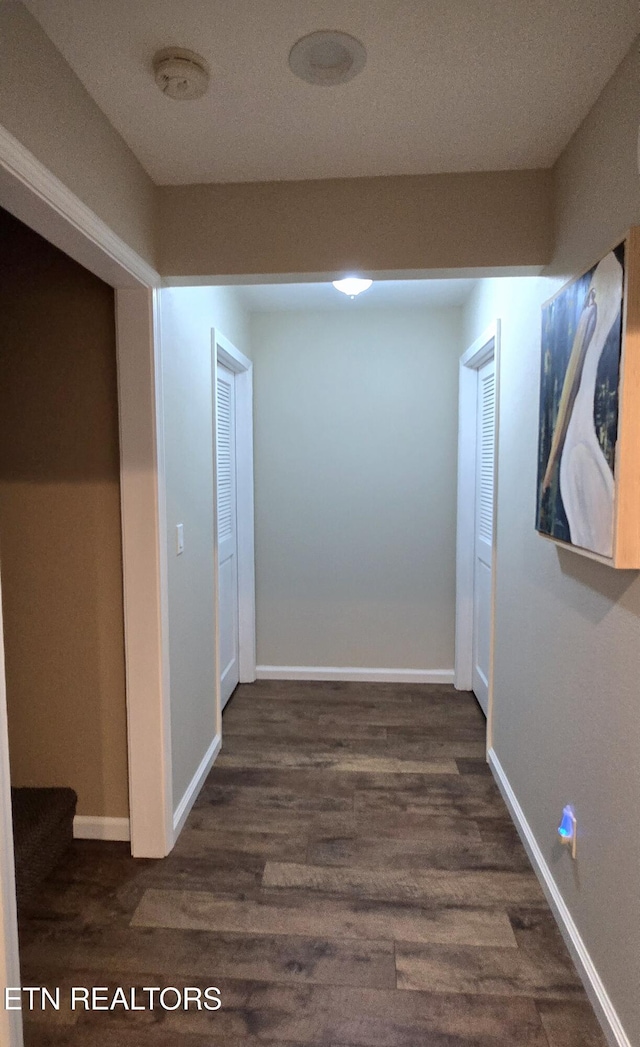 hallway featuring dark hardwood / wood-style floors