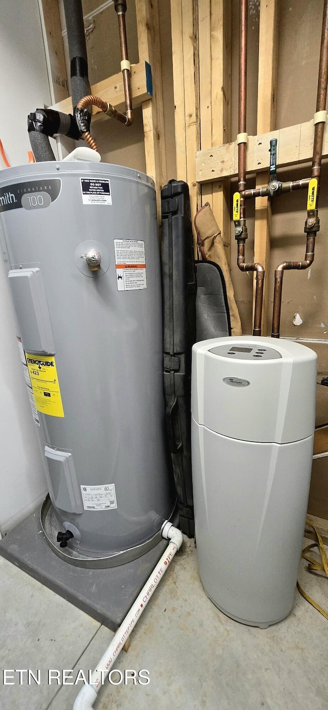 utility room featuring electric water heater