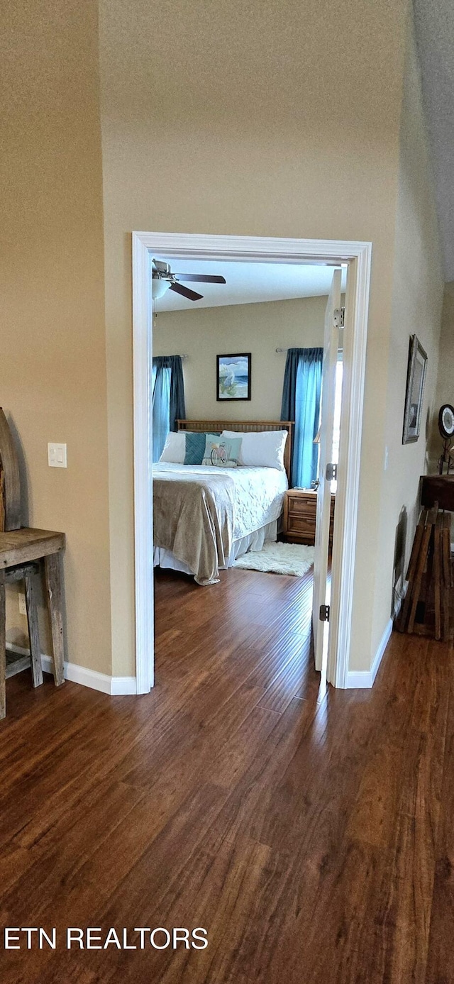 bedroom with wood-type flooring and ceiling fan