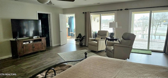 interior space featuring access to outside, ceiling fan, and hardwood / wood-style floors