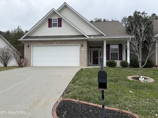 view of front of house featuring a garage and a front yard