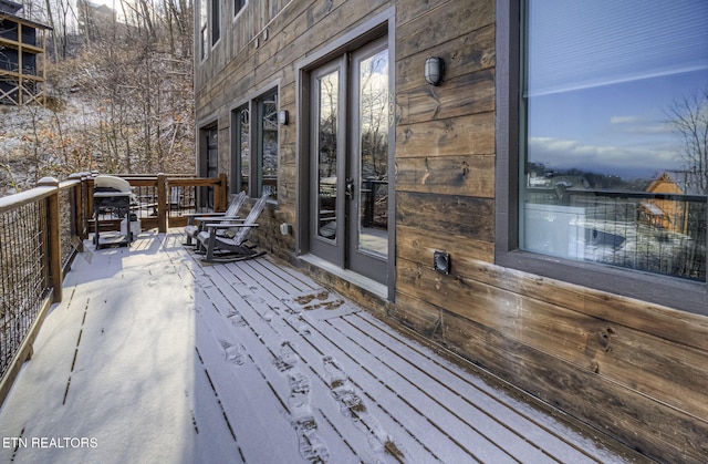 view of snow covered deck