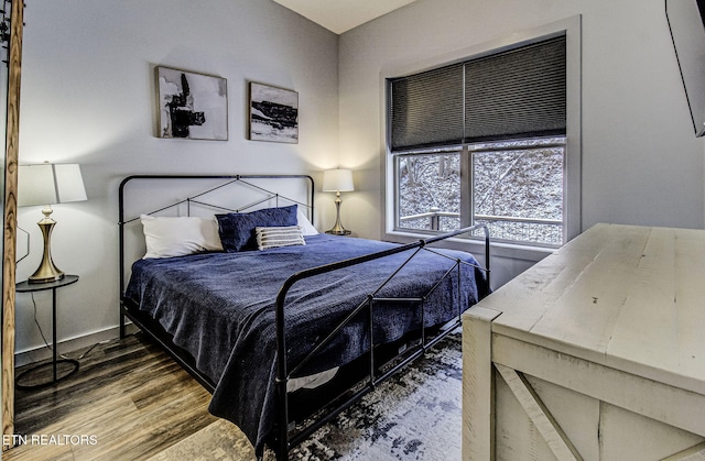 bedroom featuring hardwood / wood-style flooring