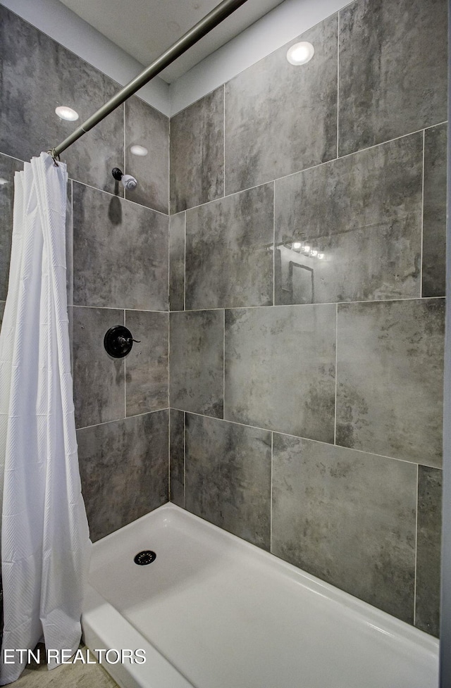 bathroom with a shower with shower curtain