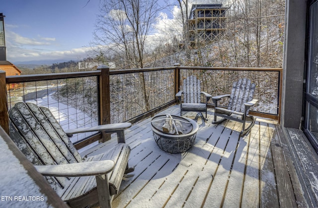 deck featuring a fire pit