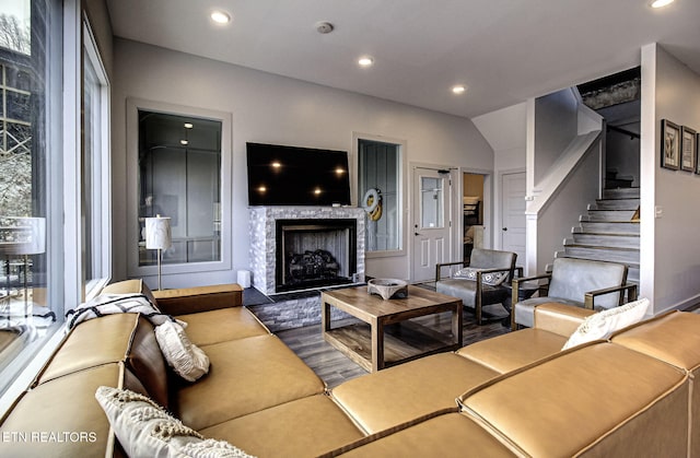 living room with a stone fireplace