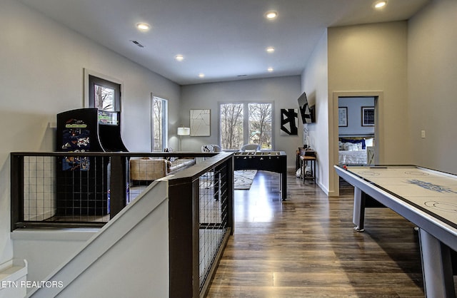 recreation room with dark hardwood / wood-style flooring