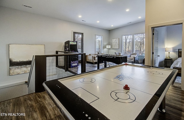 game room featuring dark hardwood / wood-style floors