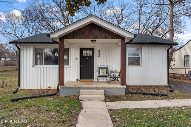 bungalow-style home featuring a porch and central air condition unit