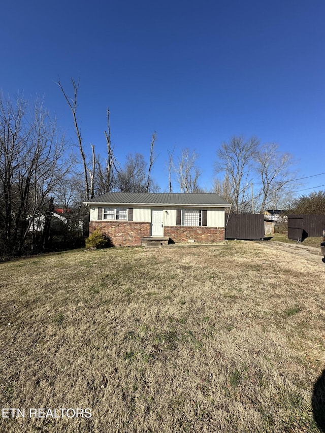 ranch-style house with a front yard