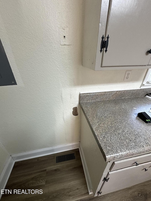 interior details featuring hardwood / wood-style flooring