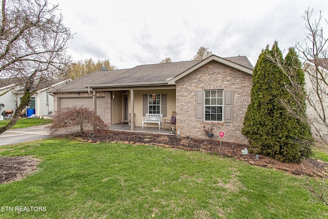 ranch-style home with a porch, a garage, and a front yard