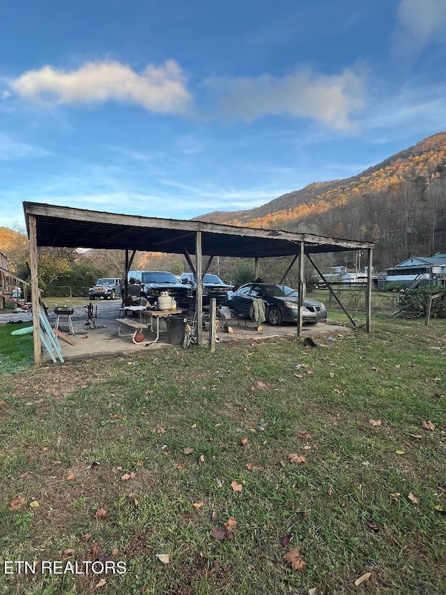 exterior space featuring a detached carport and a mountain view