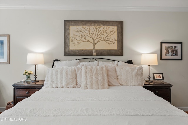 bedroom with ornamental molding