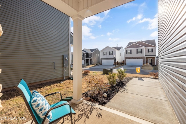 view of patio / terrace featuring a garage