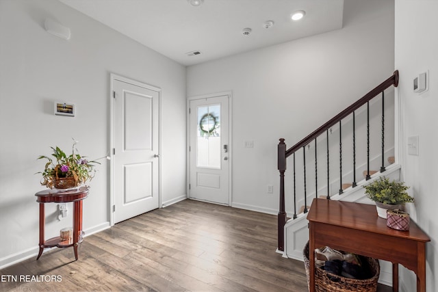 foyer entrance featuring hardwood / wood-style floors