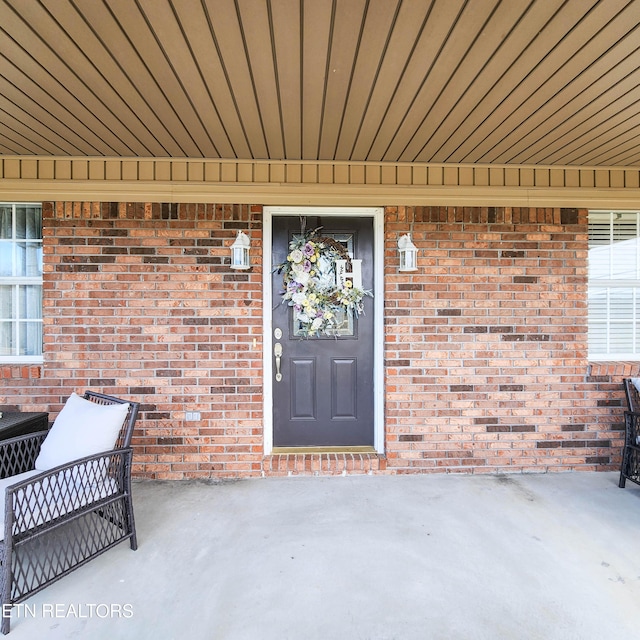 property entrance with a patio