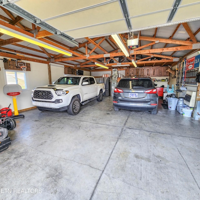 garage featuring a garage door opener