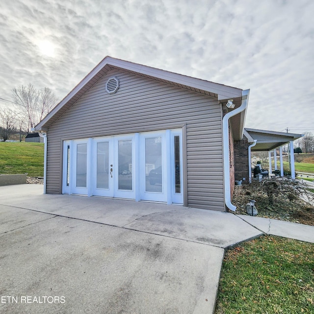 view of side of home featuring french doors