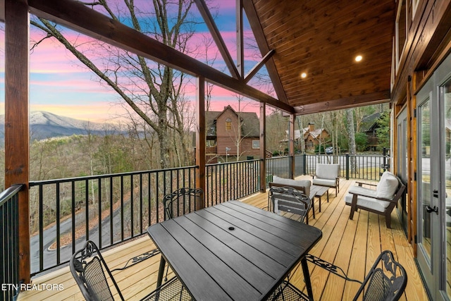 deck at dusk with a mountain view