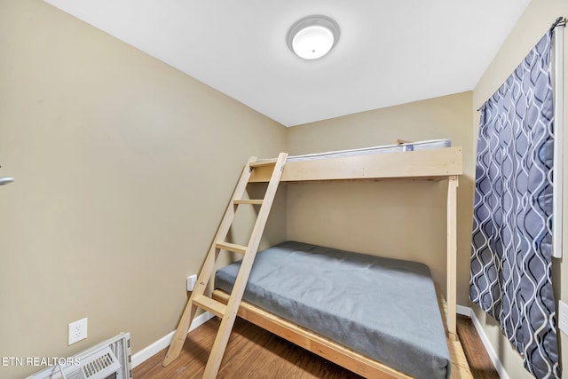 bedroom with hardwood / wood-style floors