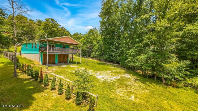 1429 Sunbeam Ln, Dandridge, TN 37725 - view of grassy yard with a deck and driveway