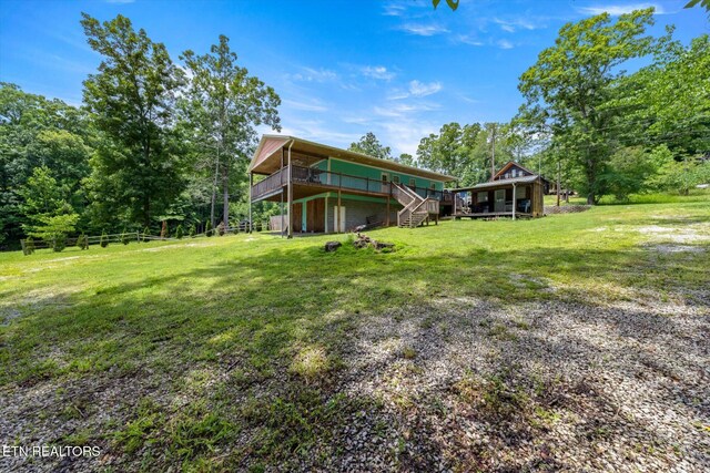1429 Sunbeam Ln, Dandridge, TN 37725 - view of grassy yard with a wooden deck and stairs