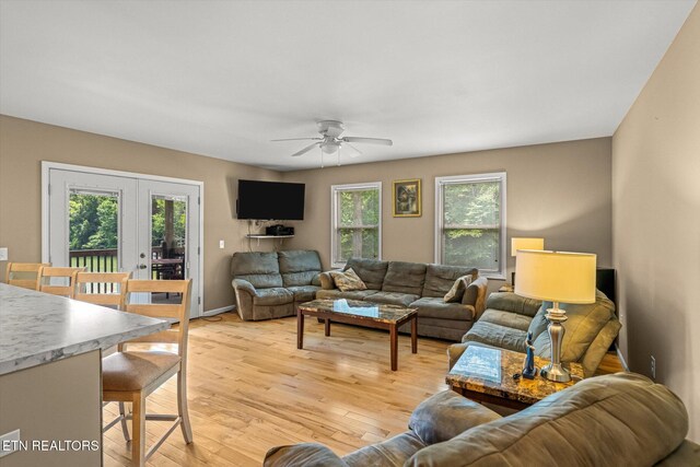 1429 Sunbeam Ln, Dandridge, TN 37725 - living room featuring ceiling fan, light wood-style flooring, and french doors