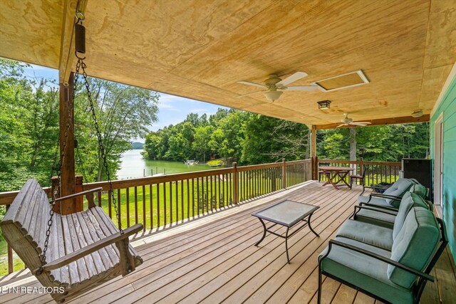 1429 Sunbeam Ln, Dandridge, TN 37725 - deck featuring a water view, a ceiling fan, view of wooded area, and a yard