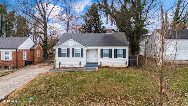 view of front of property featuring central AC unit and a front lawn