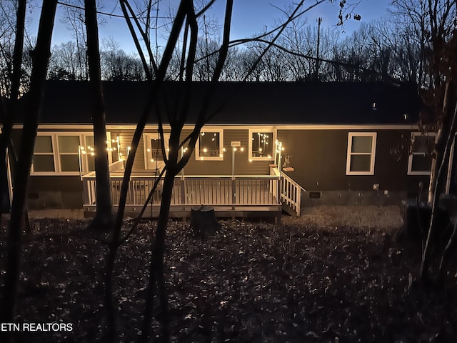 view of front of property featuring a wooden deck